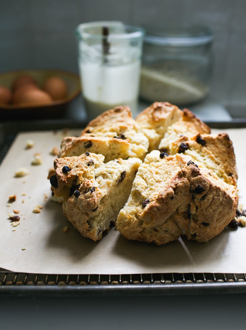 Homemade sourdough Irish soda bread with raisins, cut into thick wedges