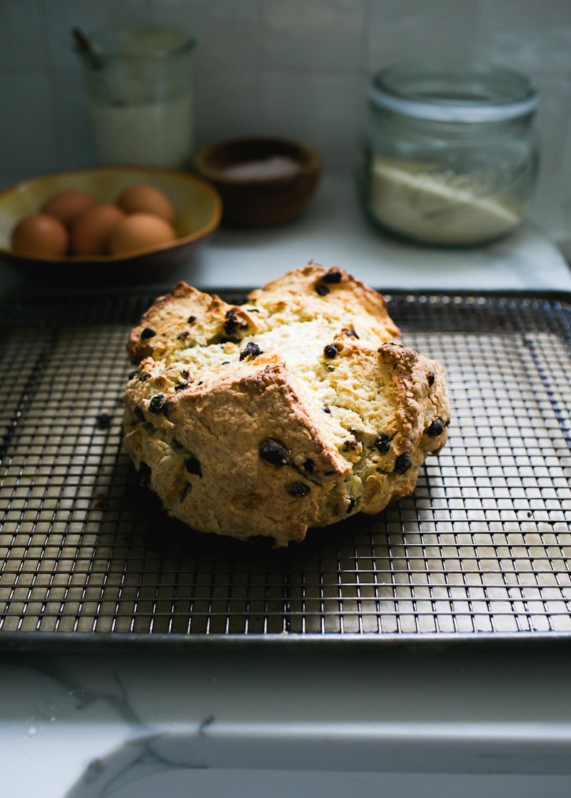 Sourdough Irish soda bread rolling down on a vintage wire rack