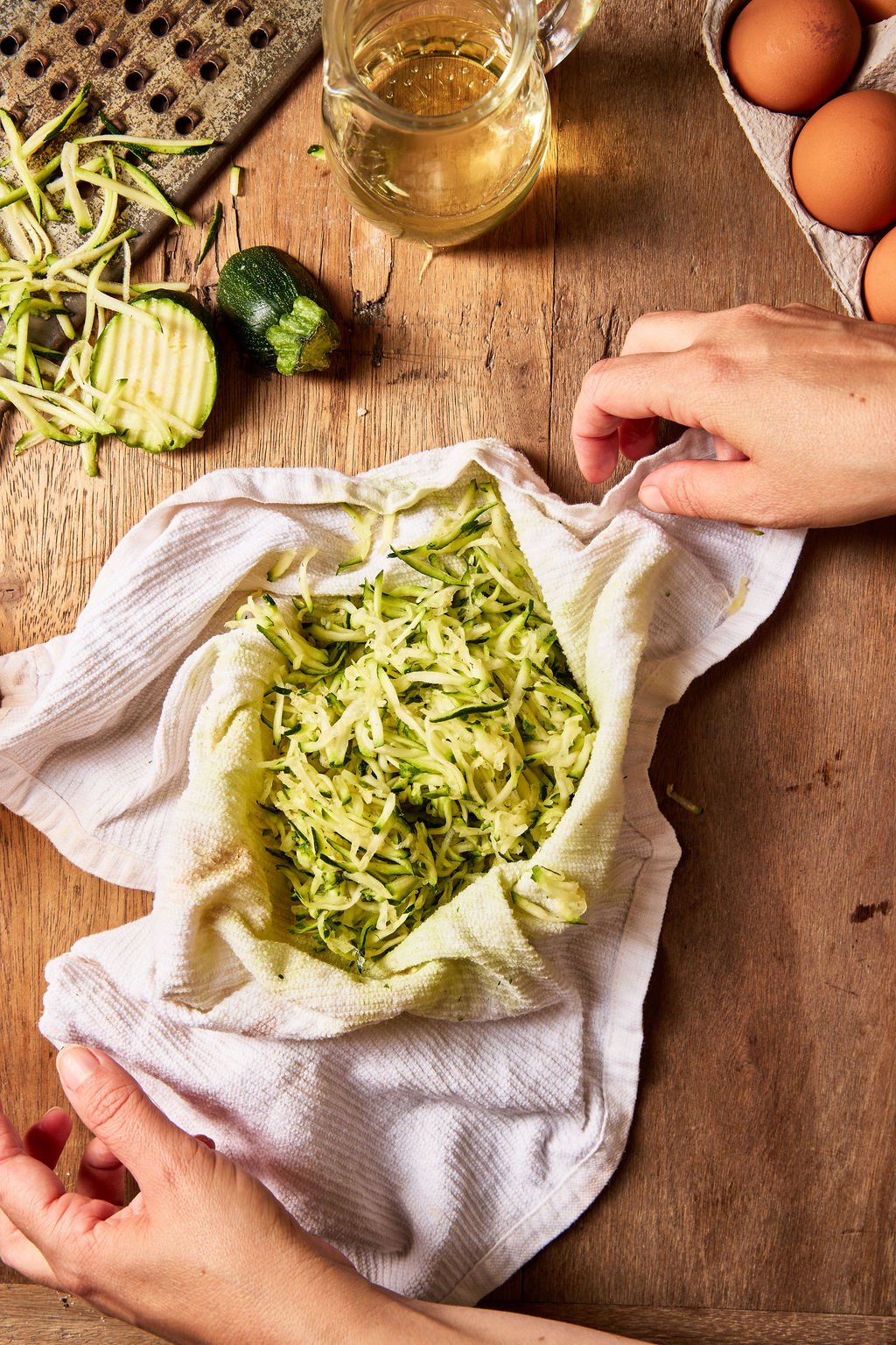 Grated zucchini in a kitchen towel