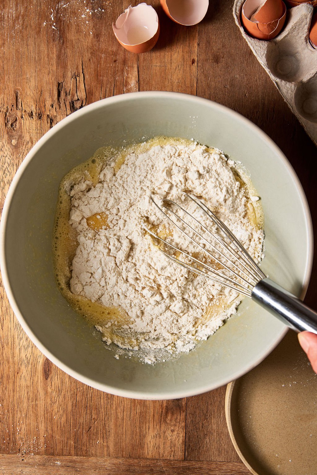 Dry ingredients added to sourdough zucchini slice batter