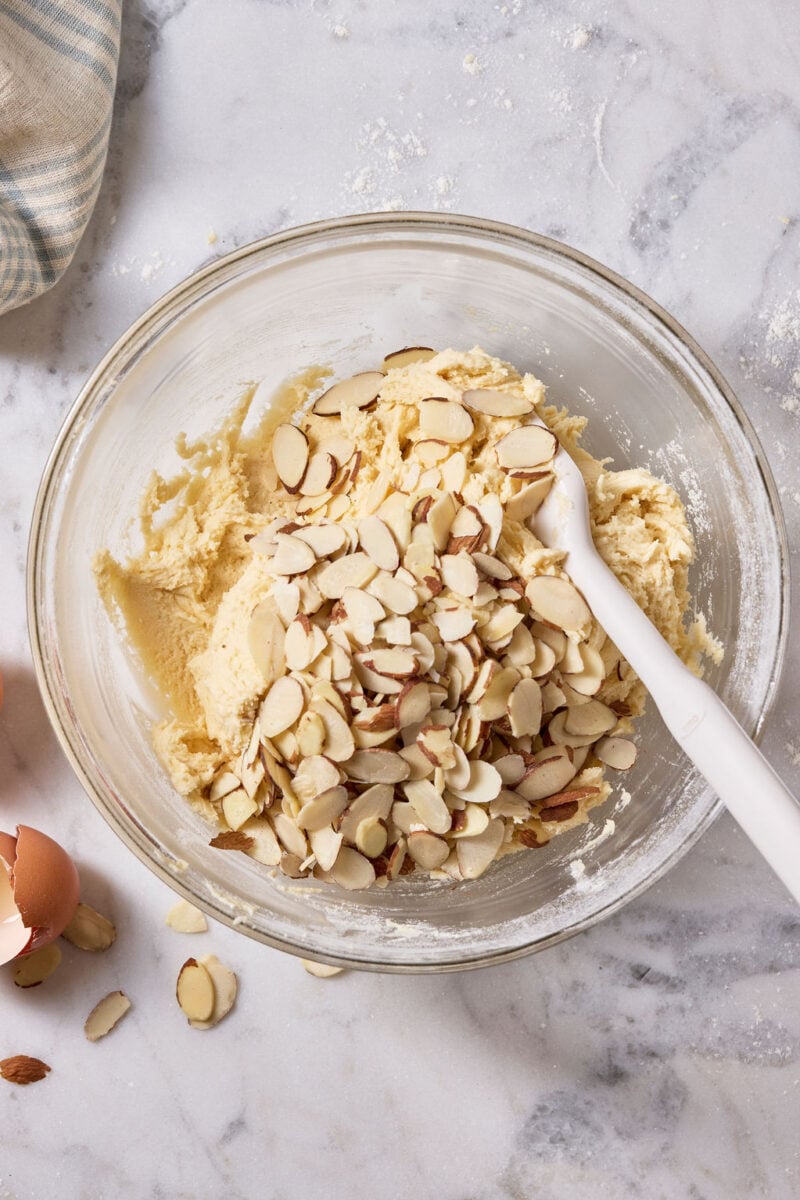 Flaked almonds folded into the sourdough biscotti dough with a rubber spatula.