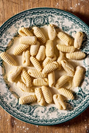 Sourdough cavatelli, homemade, on a vintage blue and white plate.