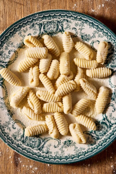 Sourdough cavatelli, homemade, on a vintage blue and white plate.
