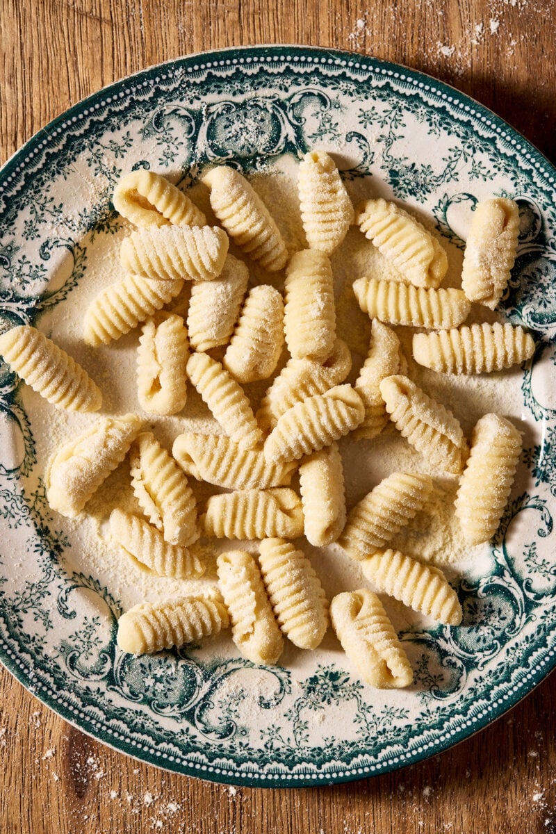 Sourdough cavatelli, homemade, on a vintage blue and white plate.