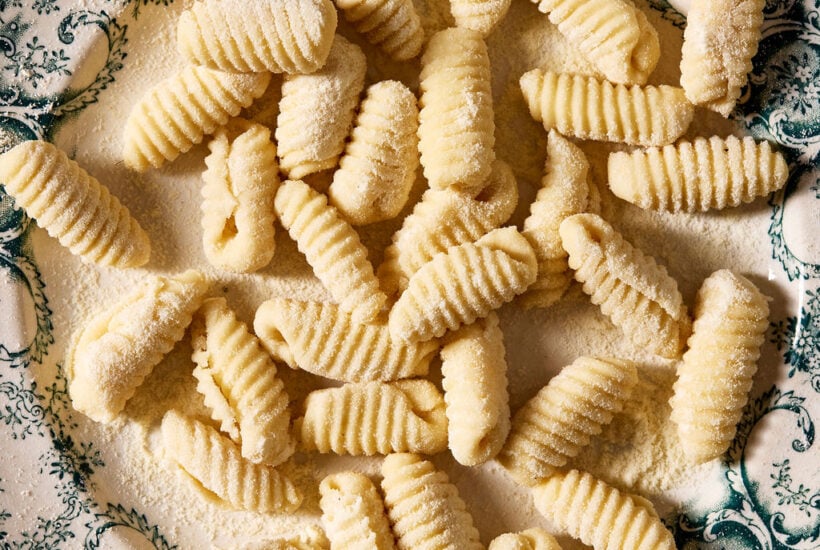Sourdough cavatelli, homemade, on a vintage blue and white plate.