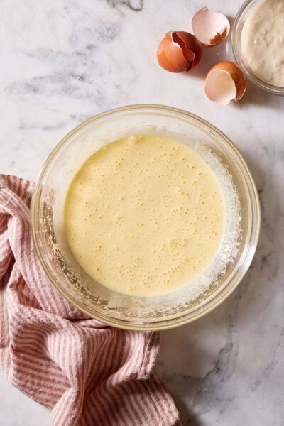 Sourdough cupcake batter with oil in a large glass mixing bowl.