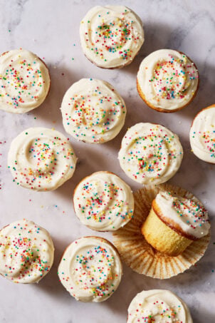 Sourdough French yogurt cupcakes with creamy vanilla frosting and sprinkles.