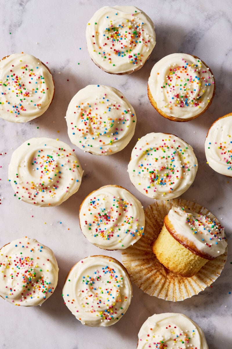 Sourdough French yogurt cupcakes with creamy vanilla frosting and sprinkles.